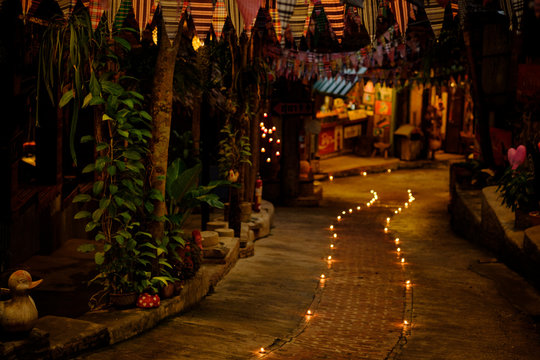 Prayer and hope concept.Retro candle light and retro road .