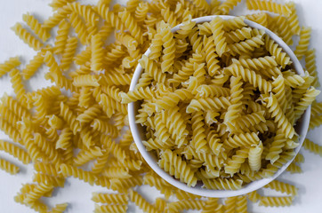 Fusilli Pasta In Bowl Isolated On White Background.