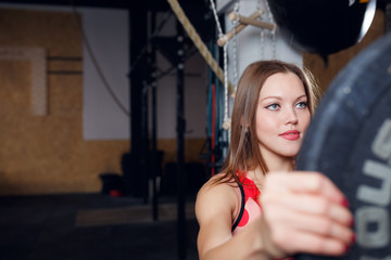 Photo of athlete woman with barbell