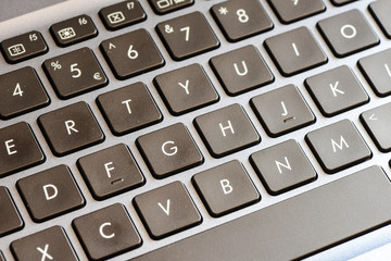 Closeup of laptop keyboard buttons with symbols 
