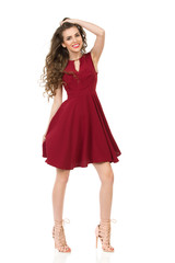 Smiling Young Woman In Elegant Burgundy Dress And High Heels