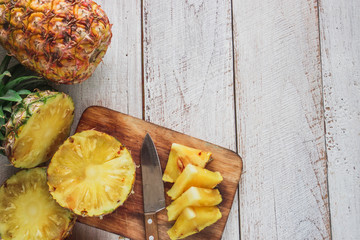 pineapple on the wood texture background
