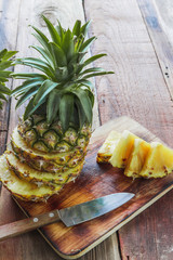 pineapple on the wood texture background
