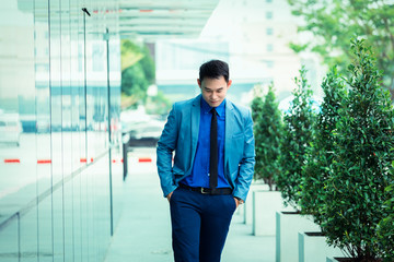 Portrait business man walking casual in the street urban street