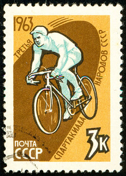 Ukraine - circa 2018: A postage stamp printed in USSR show Image of an athlete on a bicycle. Cycling. Series: Third Soviet People's Spartakiad. Circa 1963.