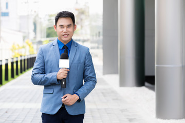 professional news reporter live broadcasting on urban street