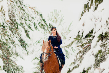 Pretty young model riding the horse