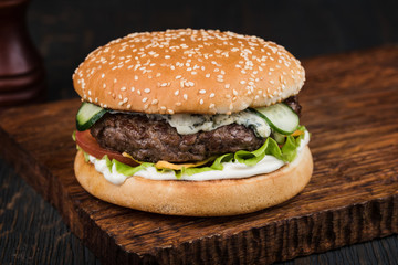 Burger on a wooden board