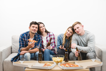 The two couples watch tv with a pizza and a beer on the white background