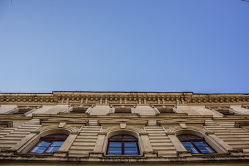 old buildings facade with blue sky background