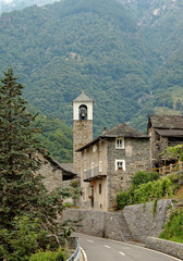 Fototapeta na wymiar Belltower of the rural village San Bartolomeo in the Verzasca Valley, Switzerland