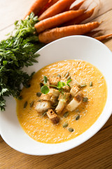 Pumpkin seeds on top of pumpkin soup