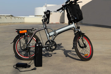 Fototapeta na wymiar Electric bicycle with battery and charger