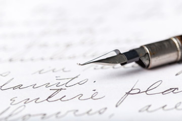 Fototapeta premium Fountain pen on an antique handwritten letter