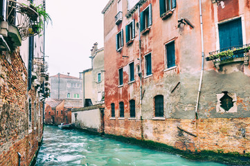 Fototapeta na wymiar Scenic canal with old buildings in Venice, Italy.