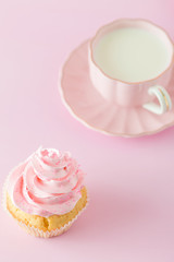 Pink pastel vertical banner with decorated cupcakes, cup of coffe with milk.