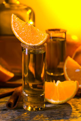 Gold tequila with orange and cinnamon .