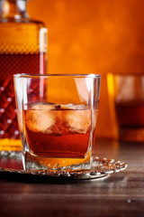 Glass of scotch whiskey and natural ice .