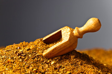 Wooden spoon with mixture of different  spices