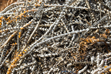 silver spirals of metal shavings as garbage, texture of different size of metal spirals shavings texture, metal shavings texture