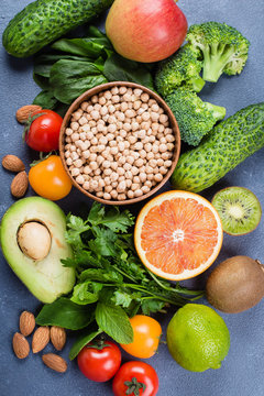 Top view and Close-up of Healthy Food Clean Concept. Raw fruits, Vegetables, Nuts, Cereals on Concrete Stone Table Background.