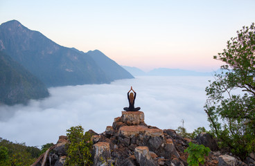 Serenity and yoga practicing,meditation at mountain range