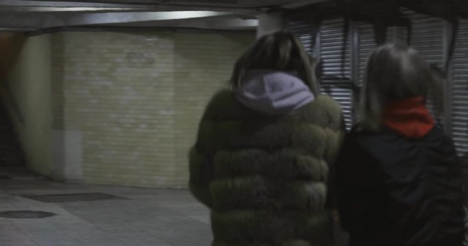 Two fashion swag girl walk in tunnel