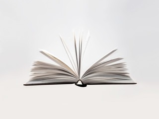 Open book, hardback, white sheets on light grey background. Education background. Back to school. Copy space for text. Close-up, selective focus