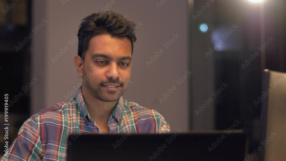 Aufkleber deadline, technology and people concept - creative man or programmer with computer working at night 