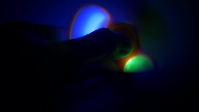 Fidget spinner with led light spinning in the dark.