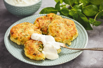 Broccoli and potato cutlets with cheese and yogurt dip.