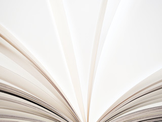 Macro view of book pages. Concept of open book, white sheets on grey and white background....