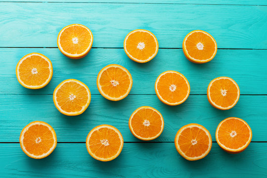 Summer. Fresh orange on blue wooden background. Mock up