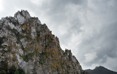 Rocky mountain and stormy cloudy sky