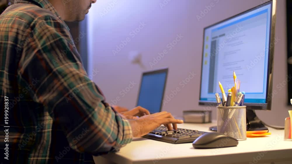 Aufkleber deadline, technology and people concept - programmer with computer working together late at night of