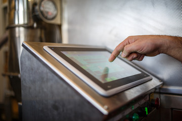 Image of computer monitor, person's hands