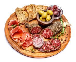 Dried organic salami sausage or spanish chorizo on wooden cutting board