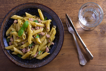 Tuna, basil and caper penne. Pasta with tuna fish. View from above, top studio shot