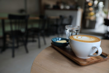 Cappuccino coffee cup on wood background