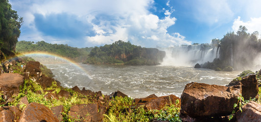 Fototapeta premium Iguazy Falls panorama with waterfalls cascades steam and rainbow, Argentine side
