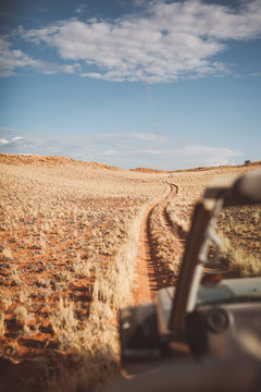 Jeep moving on dirt road in desert safari