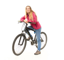 Girl in jeans on a bicycle on a white background.