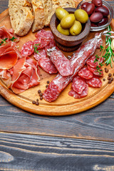 Dried organic salami sausage or spanish chorizo on wooden cutting board