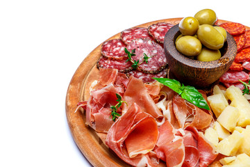 Meat and cheese plate with salami sausage, chorizo, parma and parmesan cheese