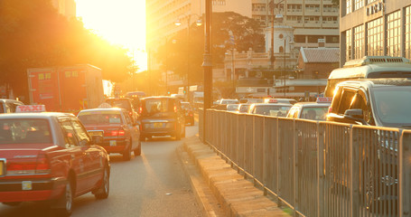Hong Kong traffic in city at sunset time