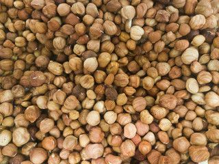 Surface covered with peanut, hazelnut, walnut, almond, pistachio nut mix