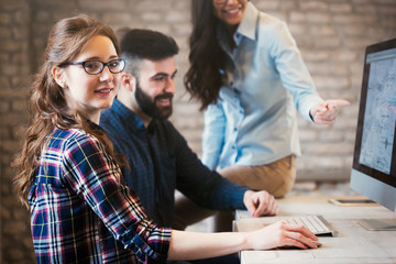 Young architects working on project in office