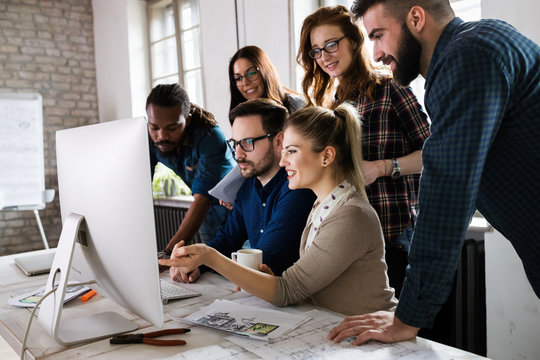 Young architects working on project in office