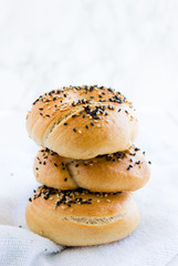 three bagels topped with black and white sesame