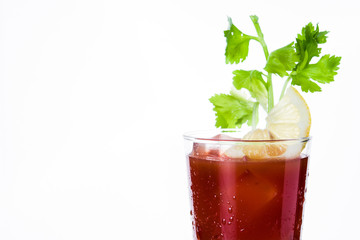 Bloody Mary cocktail in glass on white background. Copyspace

